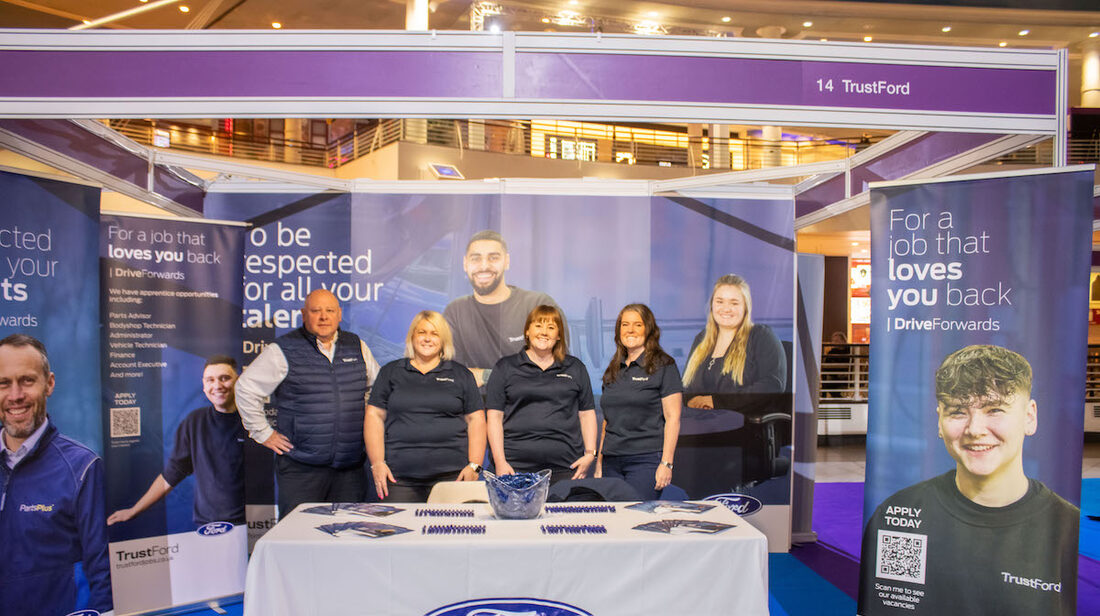 An employer meeting candidates at their stand at the MK Job Show